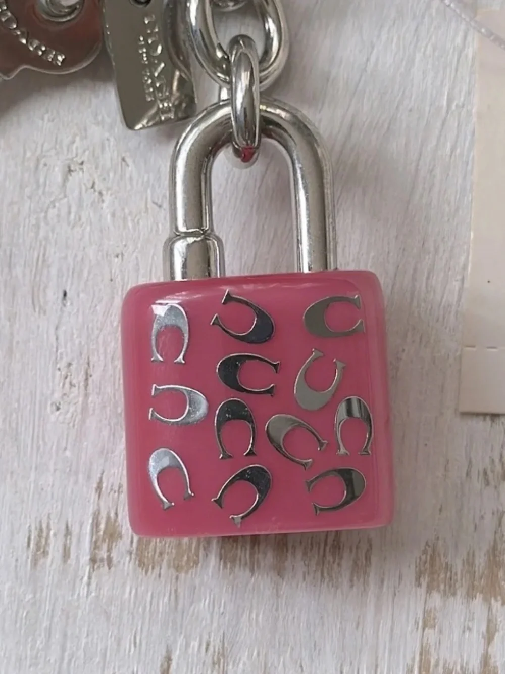 COACH LOCK AND KEY KEY RING  PURSE CHARM PINK AND SILVER NEW NWT (RETIRED) W/BOX